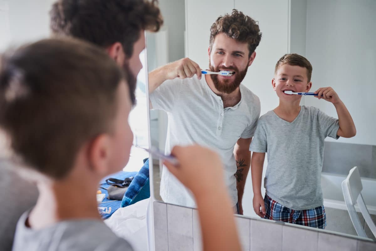 Father and son brushing their teeth | Teeth cleaning